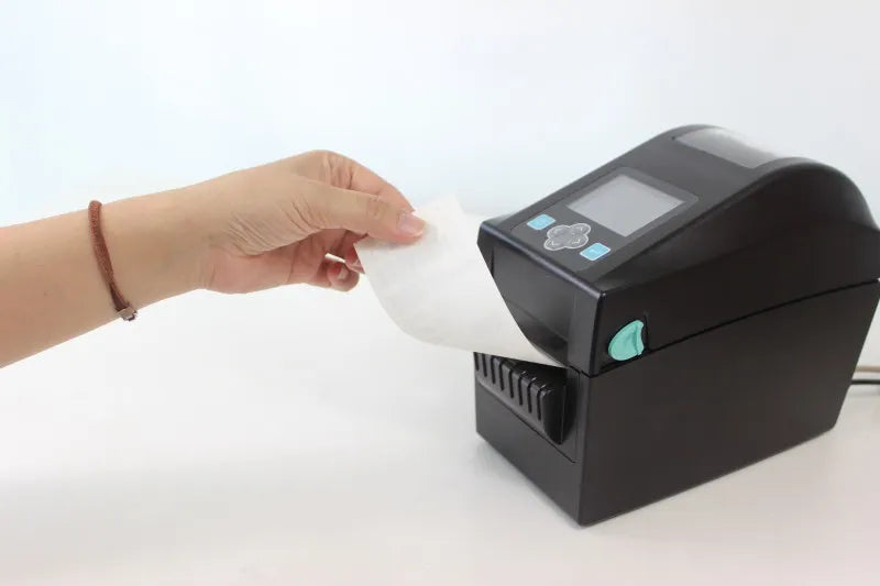 Impresora de etiquetas Godex DT230iL imprimiendo etiquetas linerless